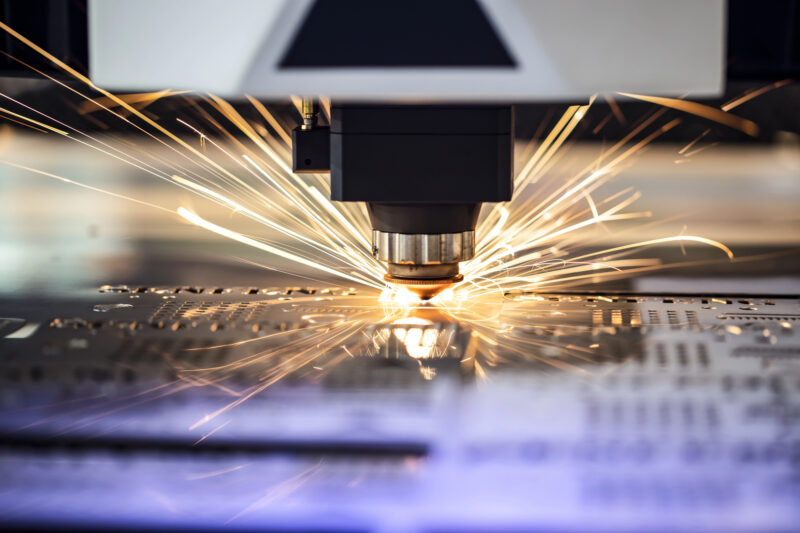 close up of a cnc laser cutting metal