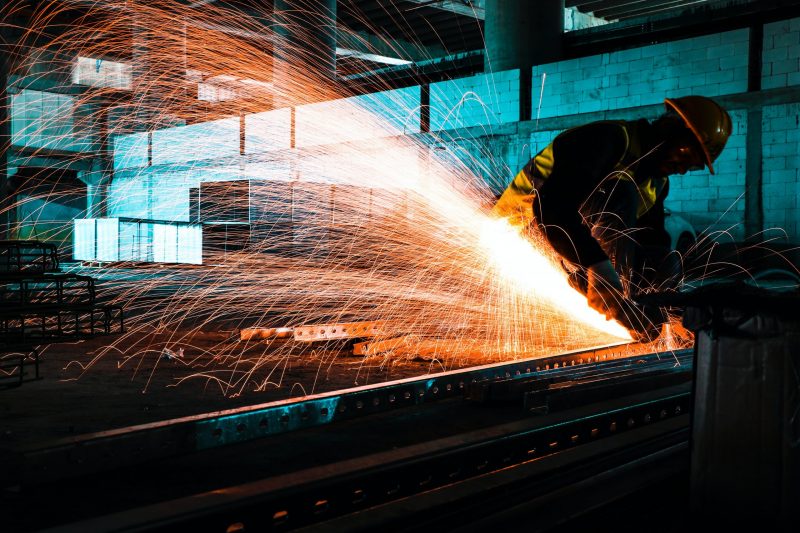 construction worker using laser cutter