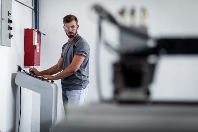 engineer working with laser cutting 