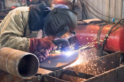 laser cutting machine, engineer working on plasma cutting