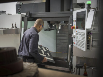 engineer preparing CNC laser machine 