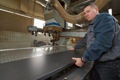 professional metal cutter working on metal fabrication project