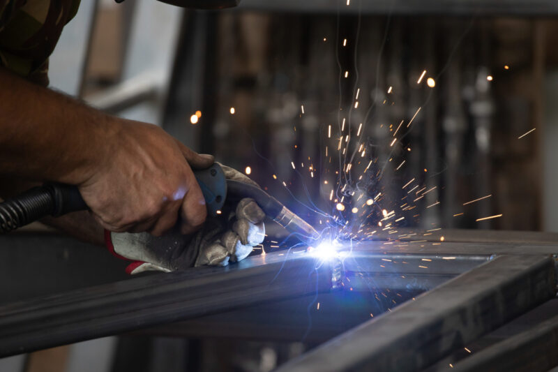 metal fabrication and welding - worker welding metal