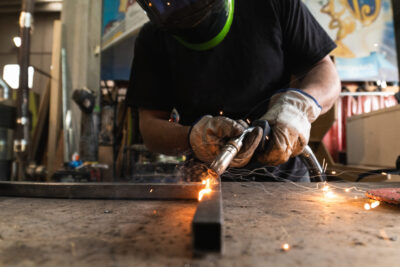 worker welding metal 