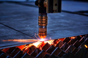 close up of laser cutting machine and it is cutting steel 